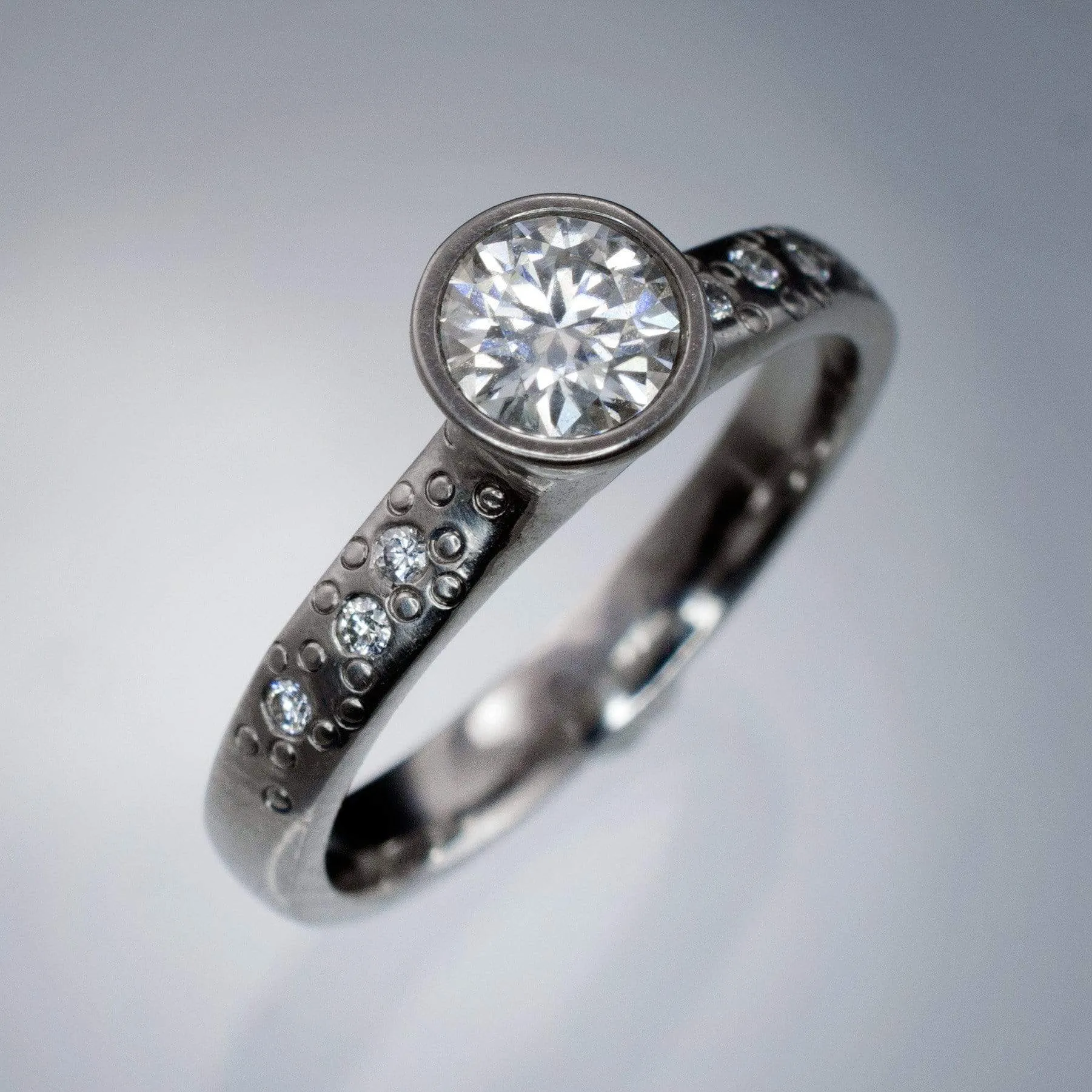 Moissanite Round Full Bezel Set Star Dust Engagement Ring