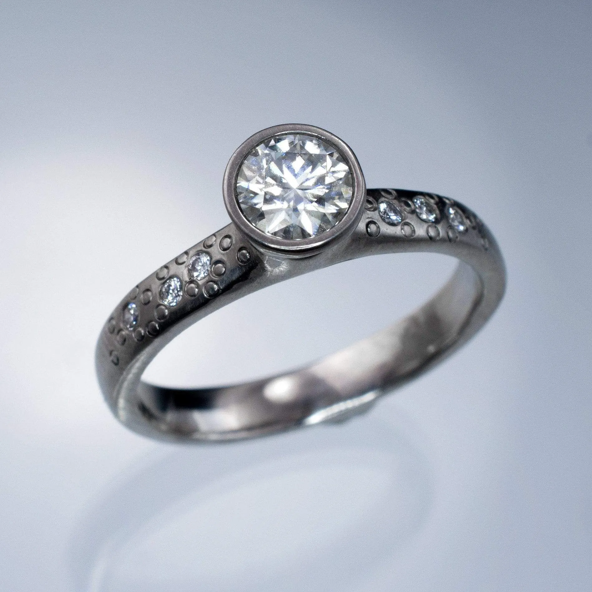 Moissanite Round Full Bezel Set Star Dust Engagement Ring